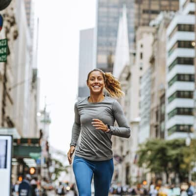 Fatigue Fighters A young Caucasian woman jogging on New York City streets