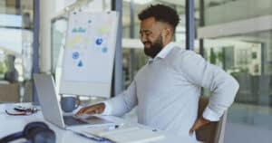 Desk worker man with back pain