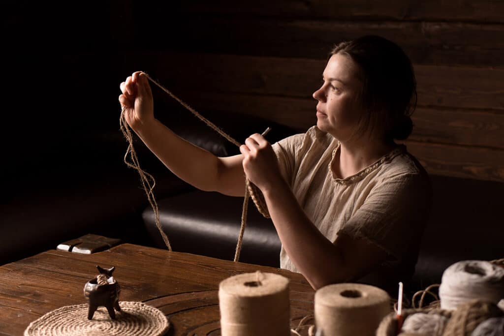 Woman knitting with yarn
